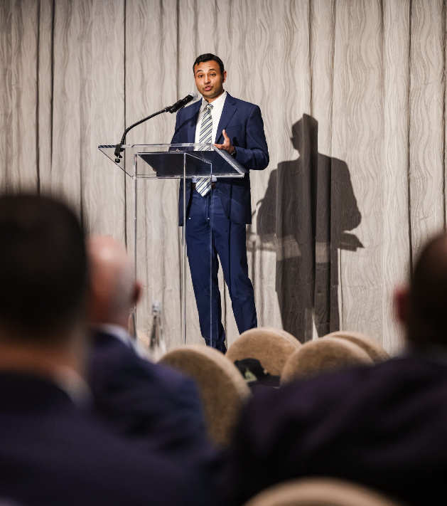 Mani Walia speaking at a Signal Peak Partners event