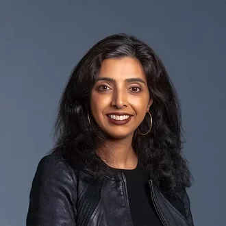 Portrait of Monica Karuturi, CenterPoint Energy, Executive President and General Counsel