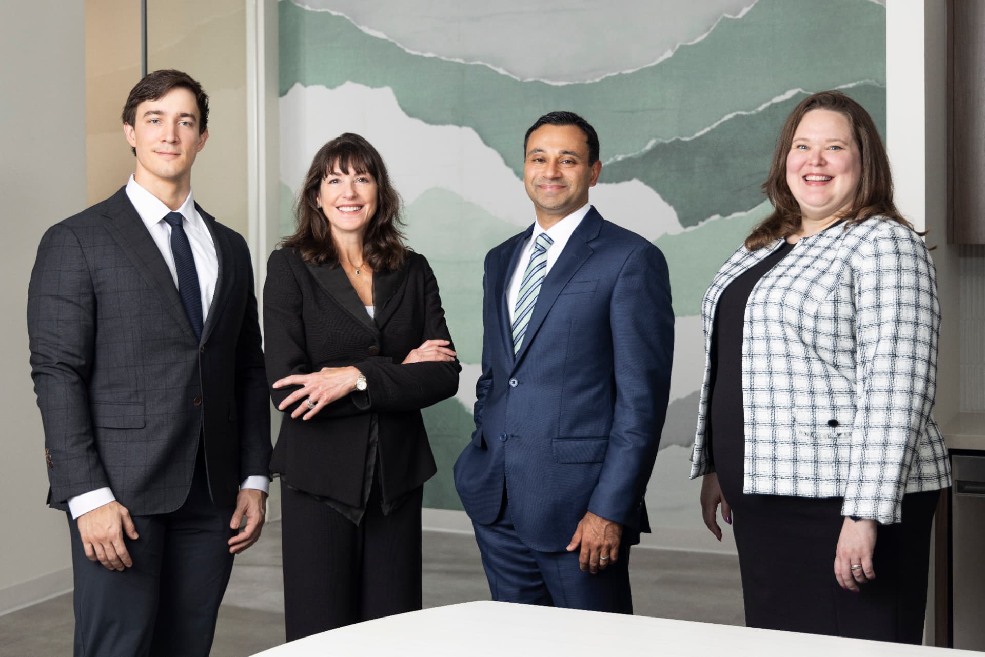The Signal Peak Partners team standing together in their Houston office