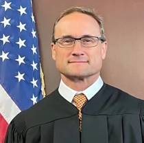 Portrait of The Honorable Derek Gilliland, United States Magistrate Judge